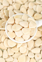 Peeled Sliced Sweet Almonds in White Bowl - Healthy Nuts Food Ingredient Background