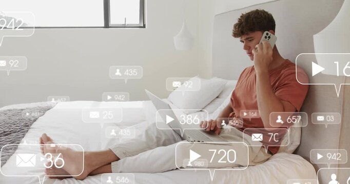 Adult male on bed, speaking on phone while typing as social media alerts appearing, driving replies