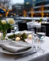 Fototapeta premium A stylishly arranged dining table featuring fresh flowers and elegant tableware, set for an intimate gathering, capturing a serene atmosphere for memorable moments.