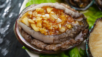 Steamed Fresh Abalone with Garlic Sauce in Shell - Traditional Asian Seafood Delicacy Dish