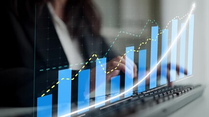 A business professional engages with statistical data on a screen, highlighting upward trends and growth in a modern office setting, symbolizing financial success and productivity. Copula - Powered by Adobe