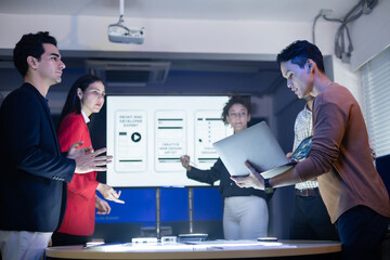 Collaborative team of diverse developers and designers planning strategy at meeting. Discussing UI, UX, web design roles, and project development. brainstorming idea, startup business teamwrok