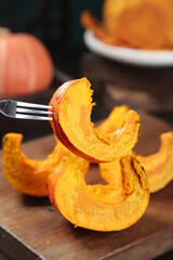 Fresh Pumpkin Slices on Wooden Board - Autumn Vegetable Preparation for Cooking