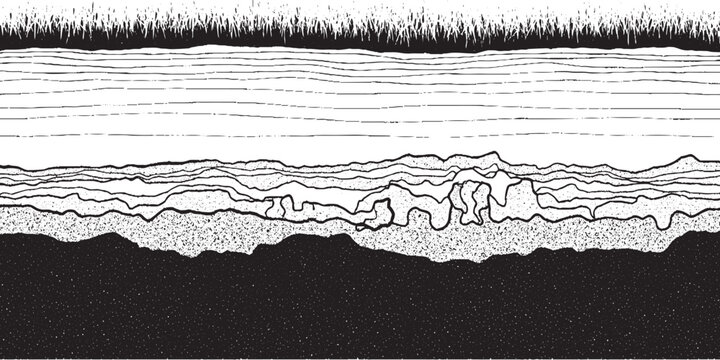 Cross section of soil layers with grass on top and dark earth below.