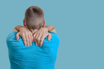 Naklejka na ściany i meble Unrecognizable man with neck and back pain rubbing his painful body neck area, Shoulder joint pain in older man, symptom of muscle tension or inflammation.