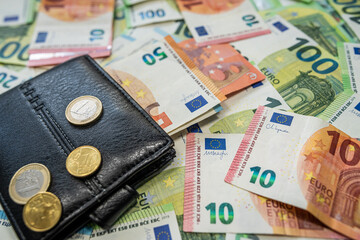 Euro banknotes and wallet background symbol of personal finance
