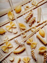  Studio flatlay of raw dried pasta.
