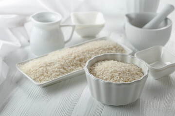 Raw organic rice in white dish.