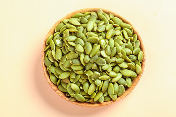 Green Pumpkin Seeds in Wooden Bowl - Healthy Snack Studio Shot