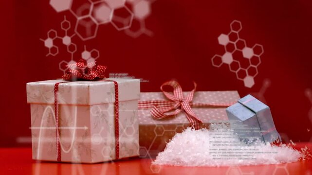 Grouped gifts moving on red tabletop, small blue box entering right, tipping into snow to settle