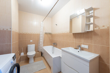 Modern Bathroom Interior with bathtub, sink, washing machine