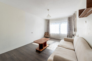 Modern Living Room with Natural Light, Wooden Furniture, and Cozy Decor