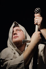 A menacing fat warrior monk with a sword