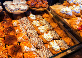 Assortment of sweet bakery and pastry displayed in showcase glass box. High quality photo.