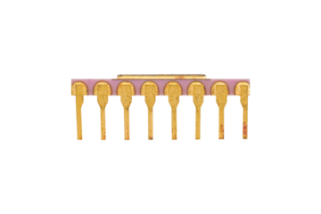 Gold-plated pink ceramic DIP microchip is isolated.