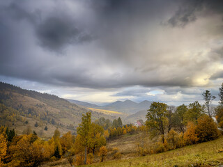 Sunny Autumn Carpathians with Puffy White Clouds