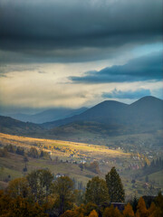 Sunny Autumn Carpathians with Puffy White Clouds