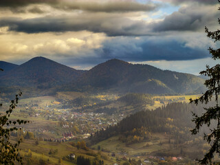 Sunny Autumn Carpathians with Puffy White Clouds