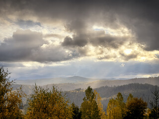 Sunny Autumn Carpathians with Puffy White Clouds