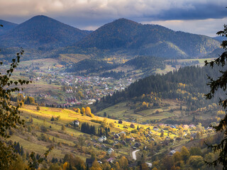 Sunny Autumn Carpathians with Puffy White Clouds