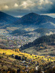 Sunny Autumn Carpathians with Puffy White Clouds