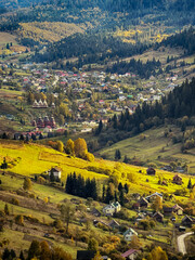 Sunny Autumn Carpathians with Puffy White Clouds