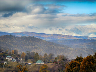 Sunny Autumn Carpathians with Puffy White Clouds