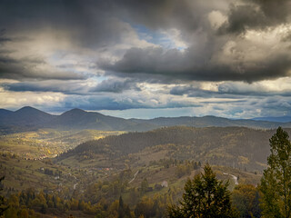 Fototapeta premium Sunny Autumn Carpathians with Puffy White Clouds