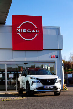 Nissan motor company logo in front of dealership building on April 12, 2025 in Prague, Czech republic.