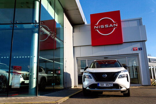 Nissan motor company logo in front of dealership building on April 12, 2025 in Prague, Czech republic.