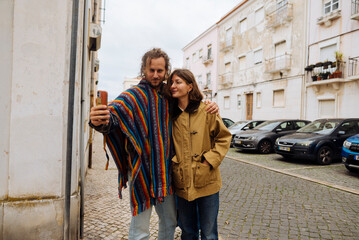 Loving partners enjoying serene walk through historic district hand in hand