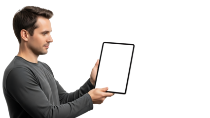 A man is holding a tablet with a blank screen, displaying technology at its finest. He seems focused and engaged, possibly showcasing the potential of a new app or device