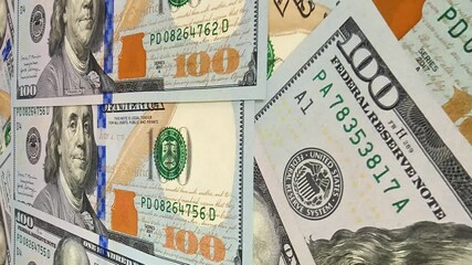 Refined movement over crisp 100 dollar bills shaping an exclusive investment oriented background that expresses the constant rhythm of monetary cash motion in business environments