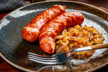 Fried sausage with onions.