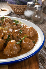 Minced meat balls in mushroom sauce.