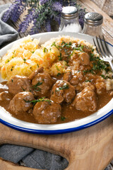 Minced meat balls in mushroom sauce.