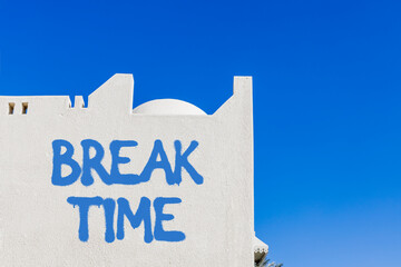 Break time symbol. Concept word Break time on beautiful white wall. Beautiful blue sky background. Business break time concept. Copy space.
