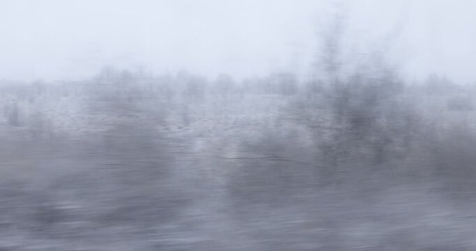 Blurred Winter Landscape from Moving Train Window