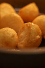 Golden roast potatoes offering a delicious and comforting side dish, ready for serving during a meal or holiday dinner