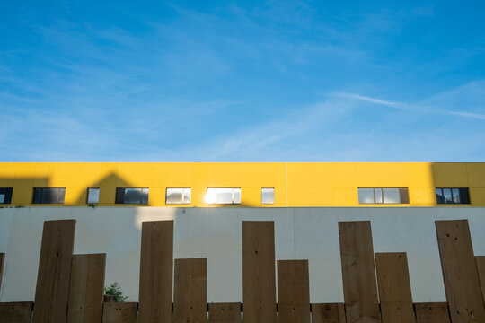Minimalism and geometry define the modern architecture facade as sunlight interacts with housing design layers, generating contrast that aligns with structured urban lines