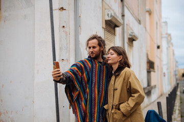 Two individuals seeking directions through colorful urban alleyways