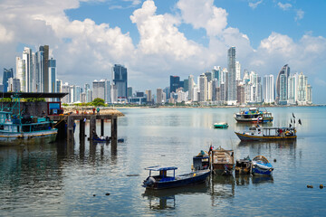 Fishermen boats and modern skyscrapers at the Panama city's Atlantic bay waterfront, Panama