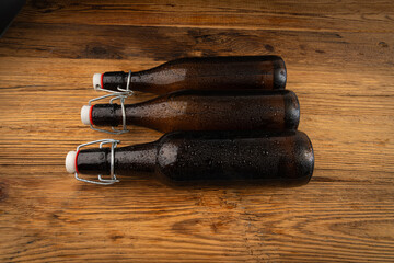 Obraz premium Old beer bottle, brown glass vintage beerbottle, a quality traditional time-tested drink symbol