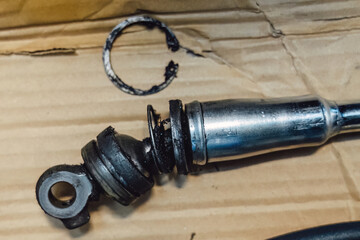 Close up: worn spherical joints and rubber dampers of the gear shift mechanism. Replacement of the linkage and bushings to eliminate play in the manual transmission.