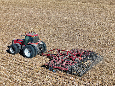 Harvard, Illinois, November 3, 2025 - Case MX285 tractor pulling a Salford I-1200 tiller to  shred corn stalks for the purpose of residue managment