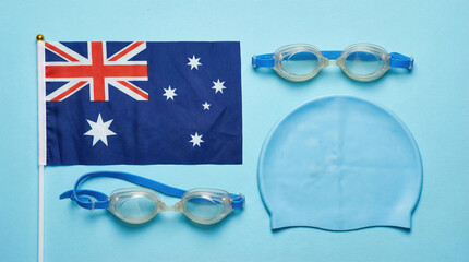 Equipment for swimming with the Australian flag and swimming gear on a blue background