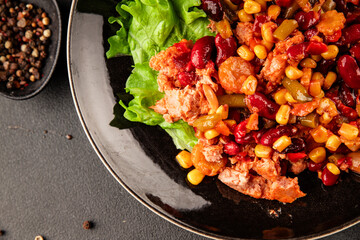 Mexican salad tuna, red beans, corn, peppers, vegetable oil seafood healthy food main course ingredient appetizer fresh tasty food table background country food top view copy space vegetarian food
