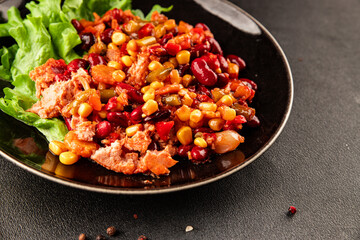 Mexican salad tuna, red beans, corn, peppers, vegetable oil seafood healthy food main course ingredient appetizer fresh tasty food table background country food top view copy space vegetarian food
