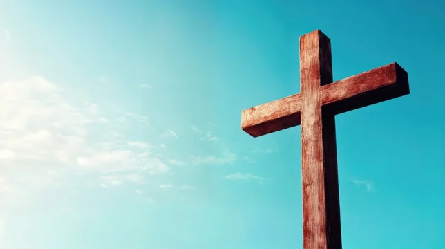 Simple Hilltop Cross Under Soft Blue Sky