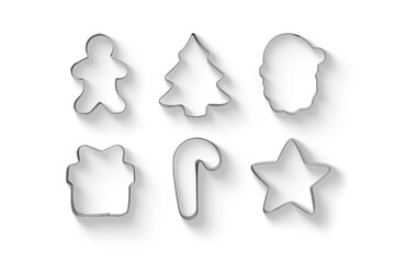 Set of Christmas gingerbread cookies metal cutters isolated on a transparent background, including star, gingerbread man and candy cane, PNG. High resolution.